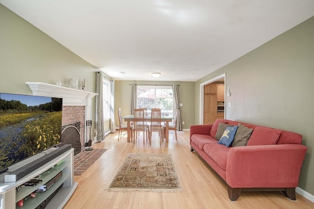 619 Pond St, Weymouth, MA 02190 - living room featuring light wood-type flooring, baseboards, and a fireplace