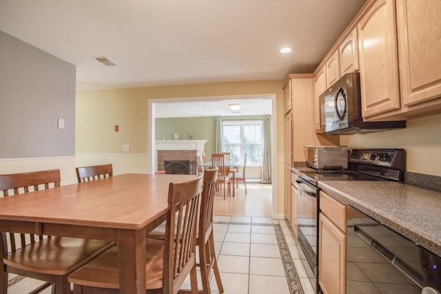 619 Pond St, Weymouth, MA 02190 - dining area with light tile patterned floors, a fireplace, recessed lighting, inlaid floor details, and baseboards