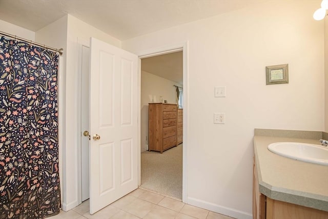 619 Pond St, Weymouth, MA 02190 - bathroom with tile patterned flooring, vanity, baseboards, and a shower with shower curtain