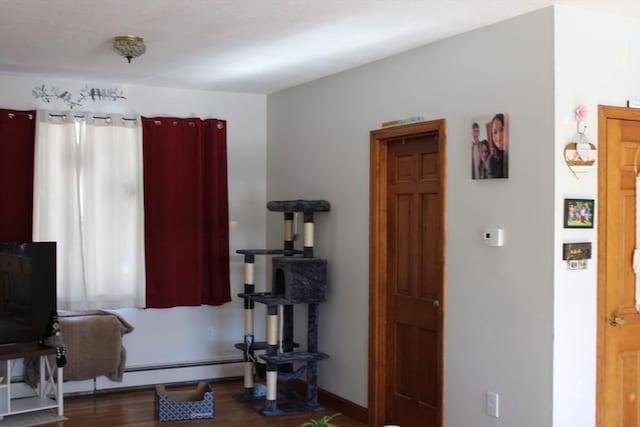 676 Bedford St, Abington, MA 02351 - interior space featuring baseboards, baseboard heating, and wood finished floors