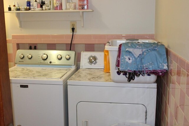 676 Bedford St, Abington, MA 02351 - laundry area featuring laundry area, tile walls, a wainscoted wall, and washing machine and clothes dryer