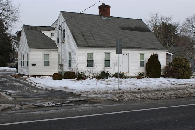 676 Bedford St, Abington, MA 02351 - cape cod home with central AC, a chimney, and a shingled roof