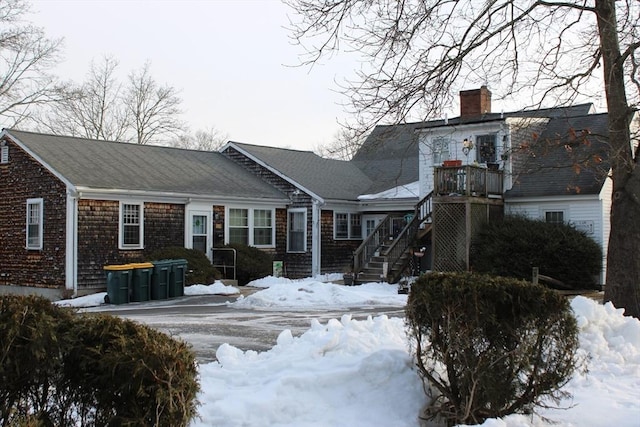 676 Bedford St, Abington, MA 02351 - snow covered back of property featuring a chimney