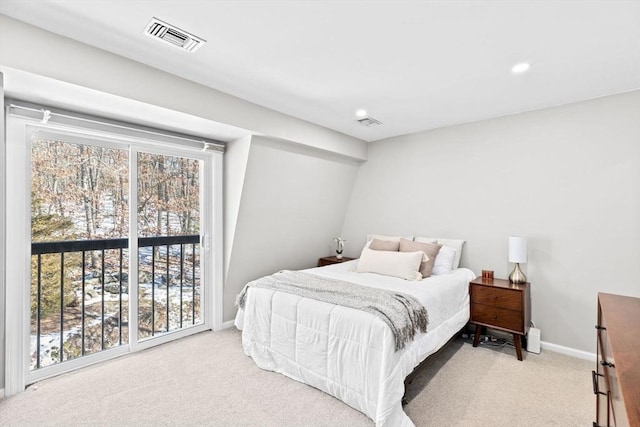 bedroom featuring light colored carpet