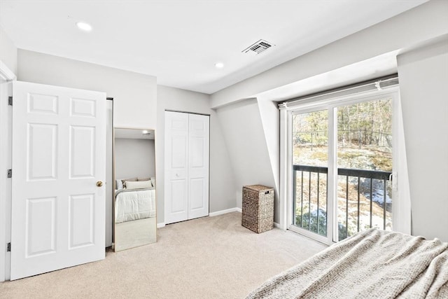 carpeted bedroom featuring a closet