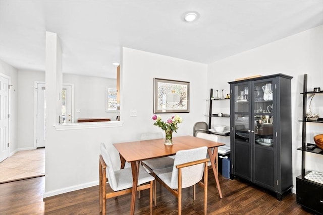 dining space featuring dark hardwood / wood-style floors