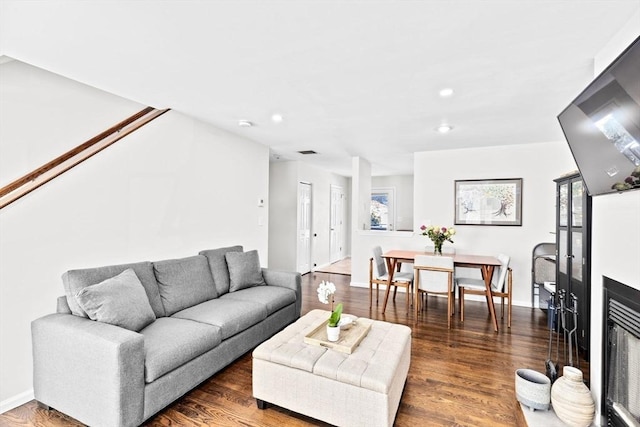 living room with dark wood-type flooring