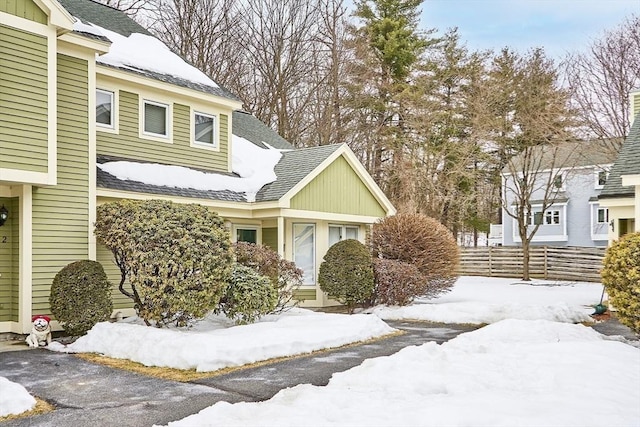 view of front of property featuring fence