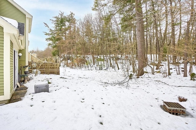 view of yard layered in snow