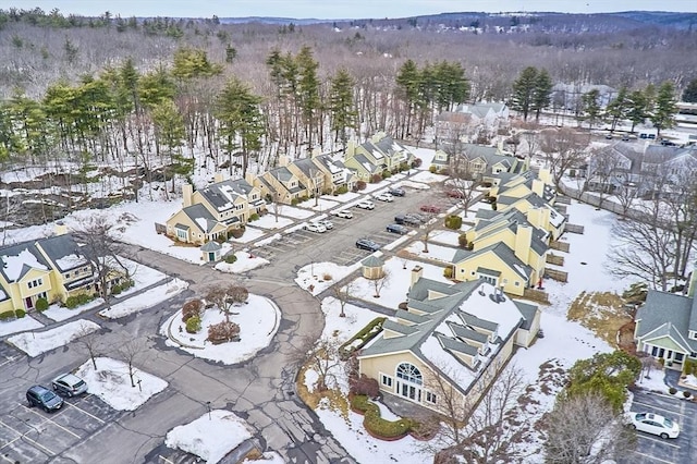 snowy aerial view with a residential view