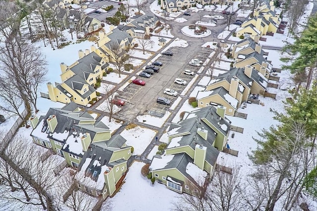 snowy aerial view with a residential view