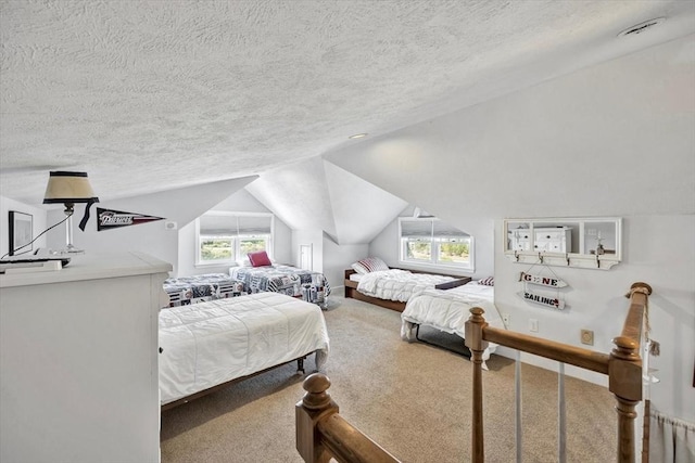 carpeted bedroom featuring a textured ceiling, multiple windows, and lofted ceiling