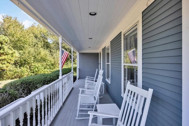wooden terrace with a porch