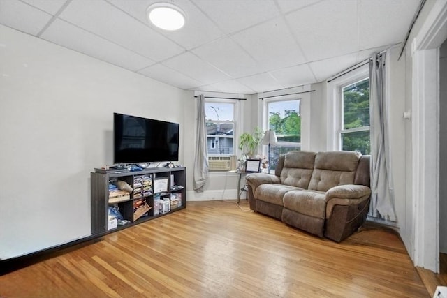 45-47 Crescent St, Swampscott, MA 01907 - living area featuring light wood-style flooring, a drop ceiling, baseboards, and cooling unit