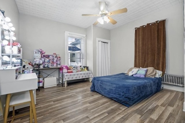 45-47 Crescent St, Swampscott, MA 01907 - bedroom with radiator, wood finished floors, and ceiling fan