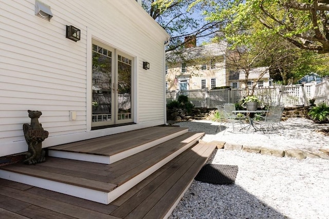deck featuring a patio, fence, and outdoor dining space