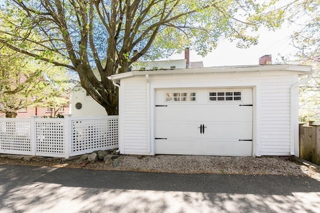 garage featuring fence