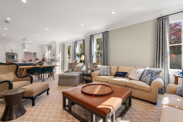 living room featuring recessed lighting and crown molding