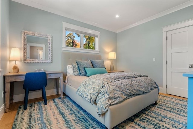 bedroom featuring ornamental molding, recessed lighting, baseboards, and wood finished floors