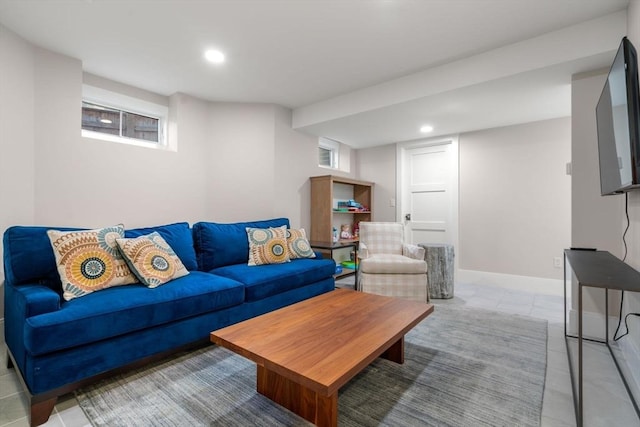 living room featuring a healthy amount of sunlight, light tile patterned floors, baseboards, and recessed lighting