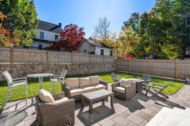 view of patio featuring a fenced backyard and an outdoor living space