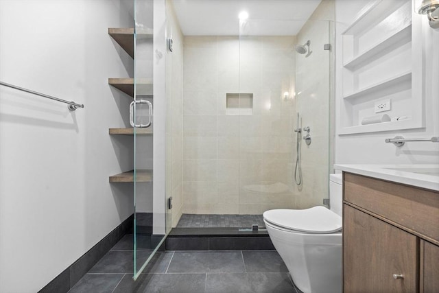 bathroom featuring vanity, a shower with shower door, tile patterned floors, and toilet