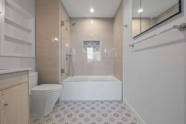 full bathroom with tiled shower / bath combo, vanity, and toilet