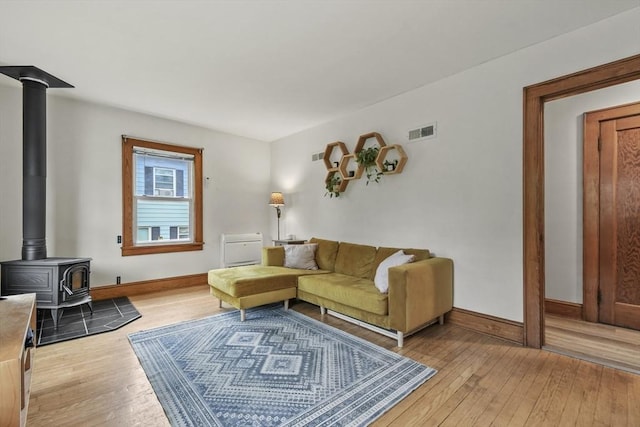 109 Euclid Ave, Pittsfield, MA 01201 - living area featuring light wood finished floors and a wood stove
