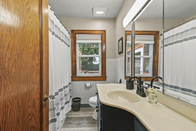 109 Euclid Ave, Pittsfield, MA 01201 - full bath featuring tile walls, vanity, wood finished floors, and wainscoting