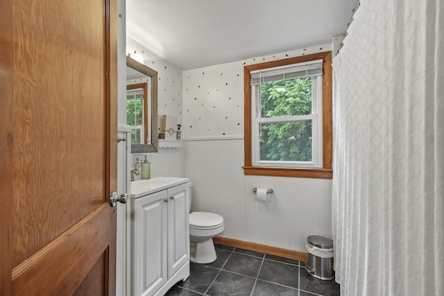 109 Euclid Ave, Pittsfield, MA 01201 - bathroom with vanity, tile patterned floors, wainscoting, wallpapered walls, and curtained shower