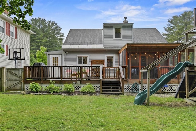 109 Euclid Ave, Pittsfield, MA 01201 - rear view of property featuring a playground, a sunroom, a deck, a chimney, and a shingled roof