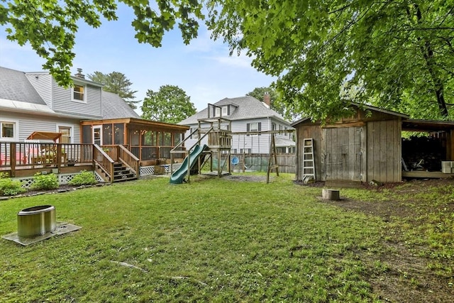 109 Euclid Ave, Pittsfield, MA 01201 - view of yard with a sunroom, a playground, a storage unit, and a wooden deck