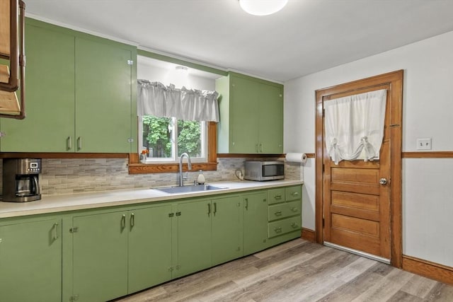 109 Euclid Ave, Pittsfield, MA 01201 - kitchen with stainless steel microwave, light countertops, light wood-style floors, and green cabinetry