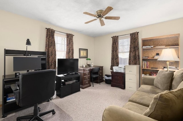 office area featuring ceiling fan and carpet