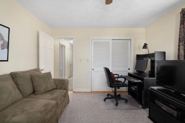 home office with baseboards and light wood-type flooring