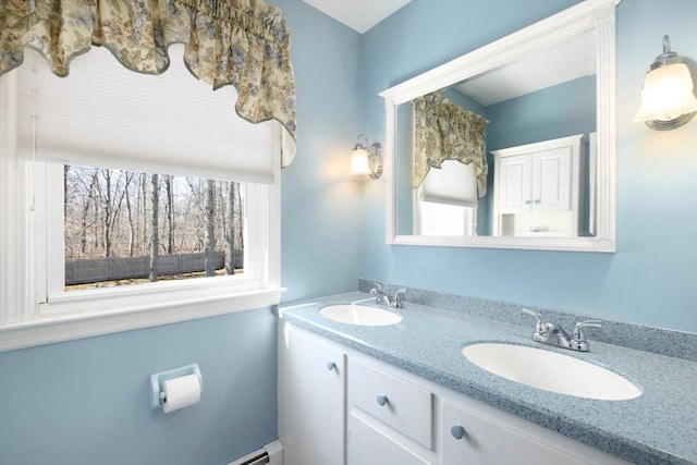 bathroom featuring double vanity and a sink