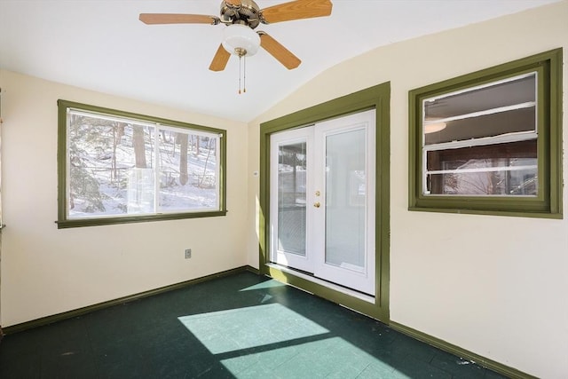 unfurnished room featuring lofted ceiling