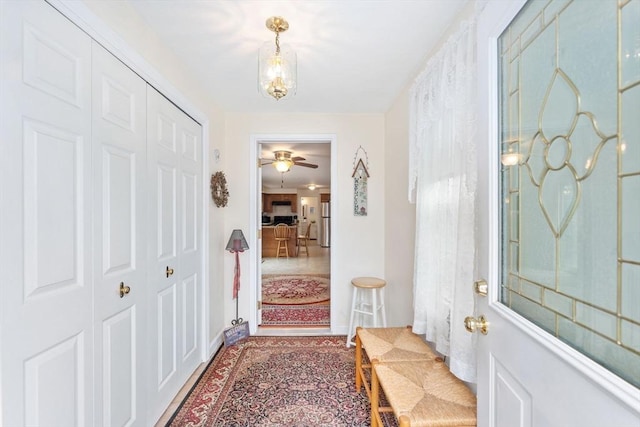 entryway featuring an inviting chandelier