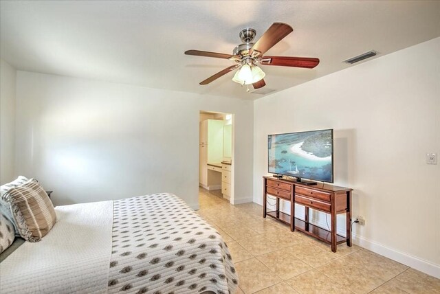 1656 Saint Clair Ave E, Fort Myers, FL 33903 - tiled bedroom featuring ceiling fan and ensuite bathroom