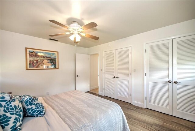 1656 Saint Clair Ave E, Fort Myers, FL 33903 - bedroom featuring two closets, light hardwood / wood-style flooring, and ceiling fan
