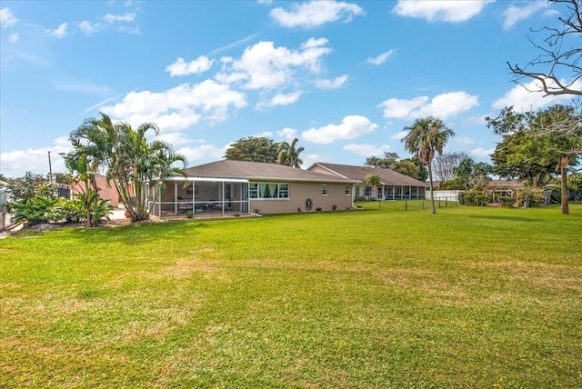 1656 Saint Clair Ave E, Fort Myers, FL 33903 - rear view of property featuring a lawn