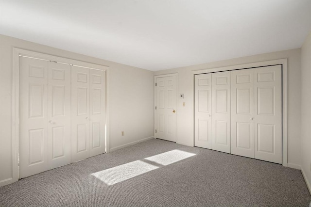 unfurnished bedroom with carpet floors