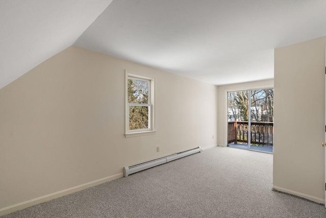 additional living space with carpet floors, vaulted ceiling, and a baseboard heating unit