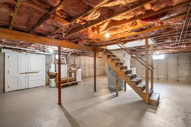 basement with washer and clothes dryer