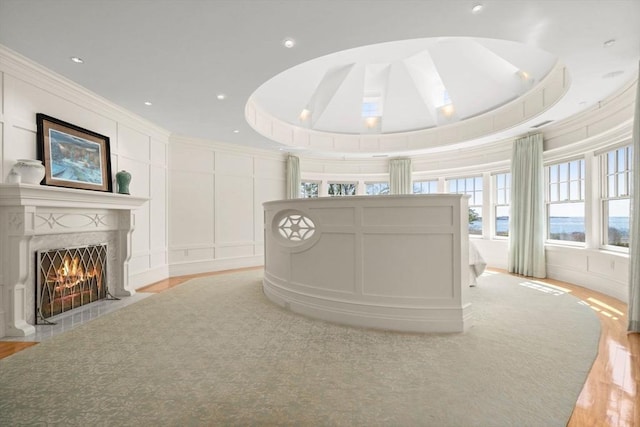 welcome area featuring a fireplace with flush hearth