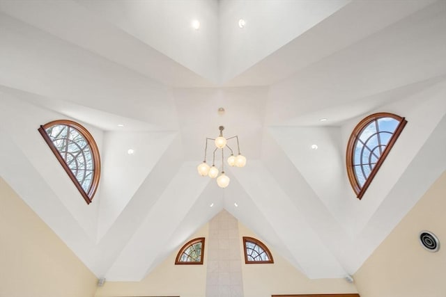 details with recessed lighting and a chandelier