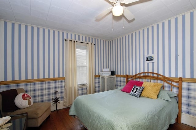 bedroom with dark wood-type flooring and ceiling fan