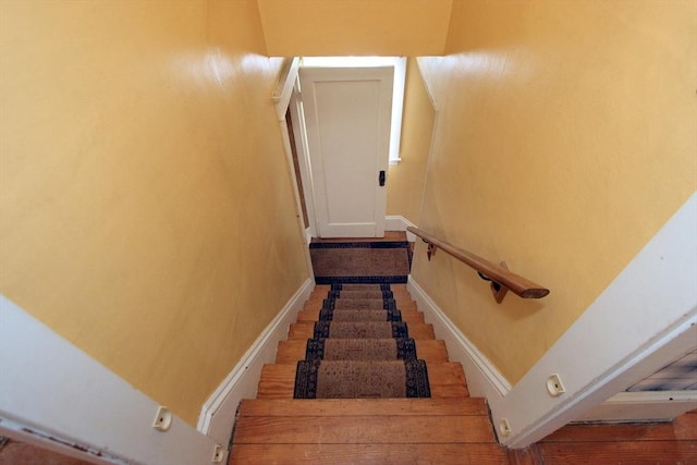 stairway featuring baseboards