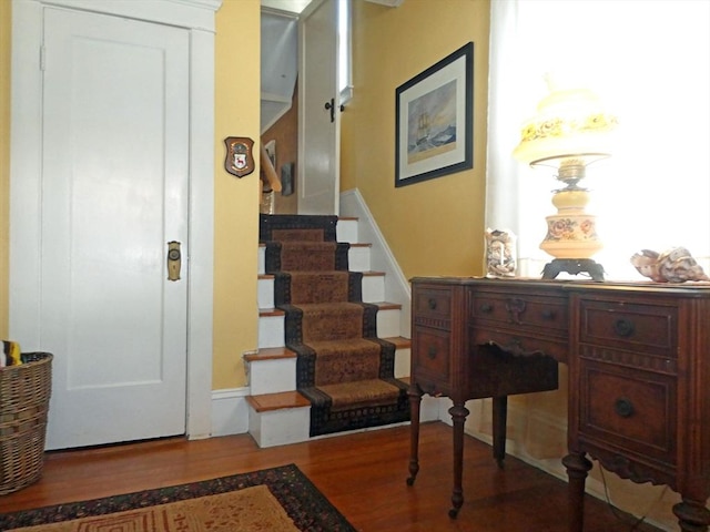 staircase featuring wood finished floors