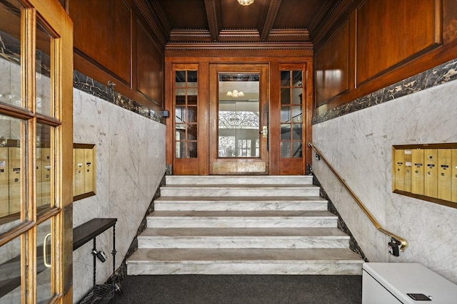 stairway with mail area and crown molding